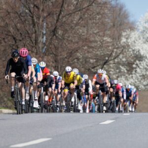 Pat Mead cycling in a large cycling group