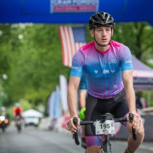 Pat Mead cycling in a cycling race